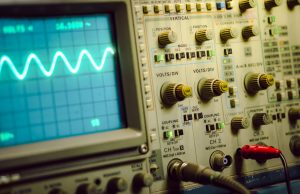 Wave on oscilloscope display, electronic oscilloscope view.